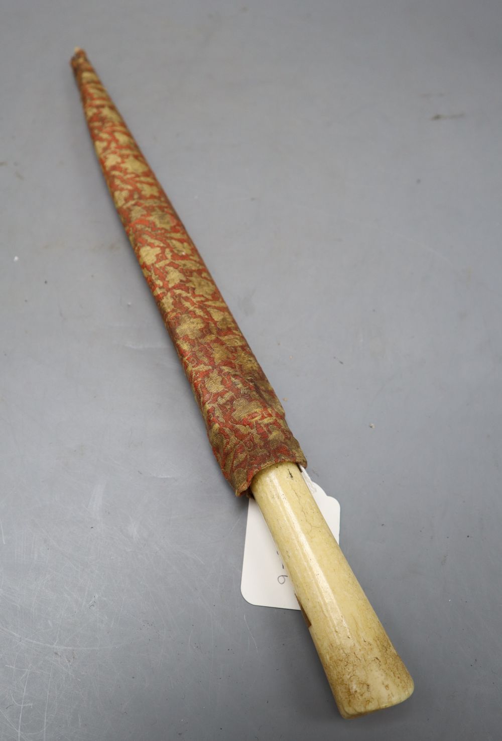 A Persian kard, bolsters and root of blade gold-inlaid with inscriptions, walrus tusk hilt, length blade point to end of handle 34cm